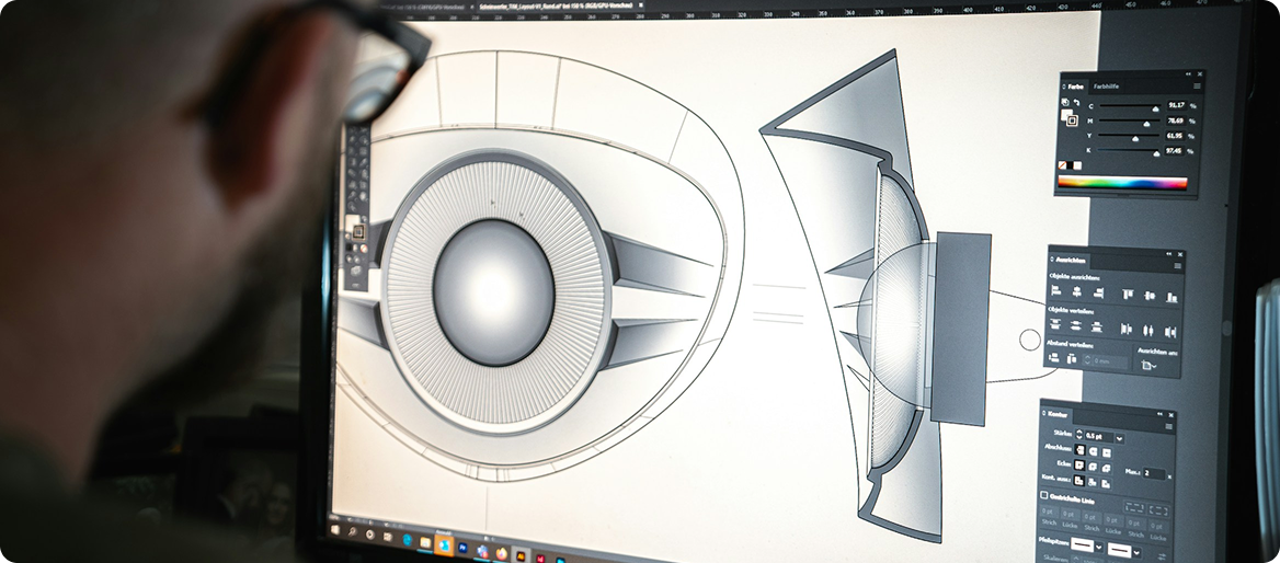 Designer working on technical product design drawing on computer screen