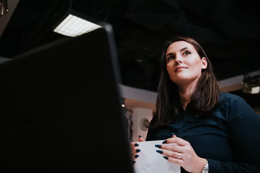 Professional woman managing intellectual property assets on computer