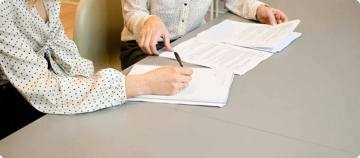 Person reviewing and signing patent annuity documents